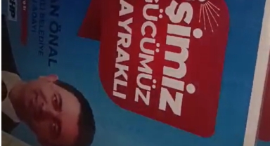 Bayraklı'da afiş krizi: AK Partililer CHP'li adayın afişlerini topladı